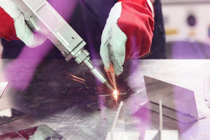 Laser beam welding of metal on welding table